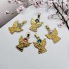 5 goudkleurige RVS hangers in de vorm van een engel met Swarovski steentjes