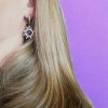 Donkerzilveren stainless steel oorringen met zon met amethist steen